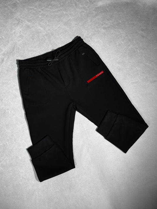 PRADA NEGRA LOGO ROJO